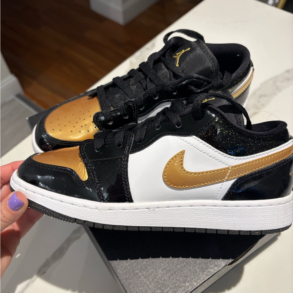 Nike Air Jordan 1 Low Gold and Black Sneakers